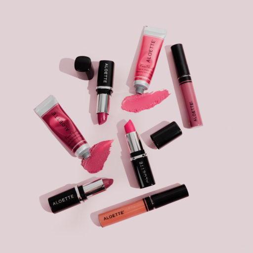 Face paint - Lipstick - Lipshine - caps off-swatches-flatlay- on pink.jpg